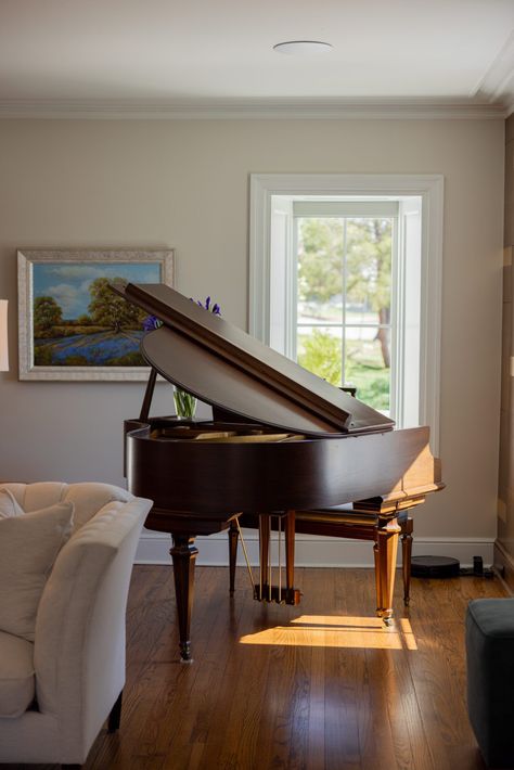 A baby grand piano is such an elegant piece to display in your living room.  1930s home renovation in Tulsa OK by Kirkendall Design #kirkendalldesign #tulsadesign #luxurydesign #interiordesign #babygrandpiano Grand Piano Living Room Layout, Piano In Modern Living Room, Home Piano Studio, Baby Grand Piano In Living Room, Baby Grand Piano In Small Space, Baby Grand Piano Room, Piano Room Layout, Small Piano Room, Piano Nook