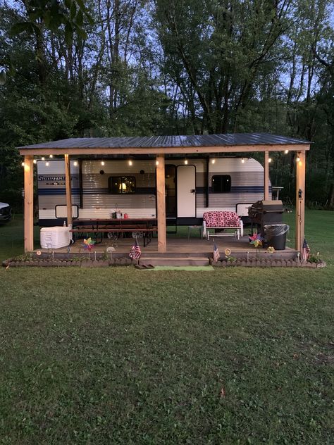 Caravan Patio Ideas, Cute Outdoor Camper Setup, Travel Trailer Patio Ideas, Travel Trailer Covered Porch, Camper Covered Deck Ideas, Camper In The Woods, Outdoor Trailer Decor Mobile Homes, Rv Living On Property, Backyard Rv Guest House