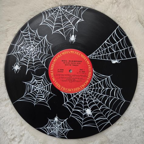 Spiderwebs are always more complex than I think they're going to be! What do you think of this one? ° ° ° #acrylicpainting #spookyart #spooky #record #vinylrecord #spiderweb #spider #uniqueart #art Vinyl Decoration Wall, Halloween Record Painting, Record Art Ideas, Spiderweb Painting, Vinyl Record Painting Ideas, Record Painting Ideas, Vinyl Record Painting, Music Art Painting, Vinyl Record Art Ideas