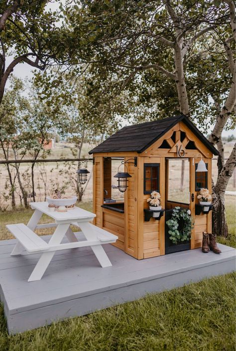 Discovery Playhouse Makeover, Playhouse In Backyard, Outdoor Playhouse Setup, Playhouse Backyard Ideas, Kid Friendly Outdoor Spaces, Backyard Discovery Sweetwater Playhouse Makeover, Outdoor Play House Ideas, Outdoor Playhouse Area, Outdoor Play Village