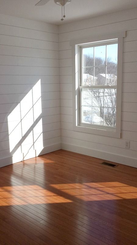 Faux shiplap walls with simple window trim and wood floors. Thinking about this for the living room. Simple Window Trim, Wood Paneling Living Room, Small Bedroom Makeover, White Wood Paneling, Shiplap Paneling, Living Room Wood Floor, White Wood Floors, Ship Lap, White Wood Wall