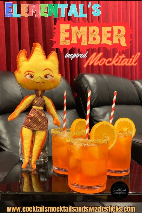 this image shows three orangey-red drinks with orange wheel garnish and red striped staws with Elementals Ember plush next to them set in a home theater. Disney Themed Drinks, Themed Dinners Ideas, Disney Themed Party, Disney Movie Night Menu, Disney Themed Movie Night, Disney Movie Night Food, Disney Inspired Cocktails, Disney Cocktails, Disney Movie Night Dinner