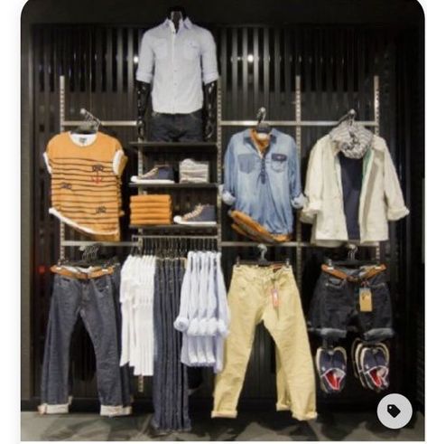 This is an excellent use of space. Each item is exactly the right size. It can accommodate a large amount of inventory without becoming crowded. This display can include both designs and mannequins wearing T-shirts. The outfits are displayed and hung in different outfit orders on this wall display, which has a great layout. Mens Fashion Shop Interior Retail Stores, Mens Shop Interior Store Design, Clothing Store Displays Men's, Mens Store Display, Men's Clothing Store Design, Retail Layout, Denim Display, Mens Boutique, Boutique Store Displays