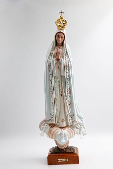 Statue of Our Lady of Fatima This statue has glass eyes, a crown and movable doves. It is Hand Painted and Features a Glitter Gown. 23 INCHES (58 cm) - Tall without the Crown With Beautiful Glass Eyes Base in Wood It is Hand Painted and Features a Glitter Gown. The Best Quality Work in Details and Finish of Religious Art Our Lady of Fatima Statue Resin made of Quality Resin and Individually Hand Painted and Hand Decorated Our Lady Of Fatima Statue, Virgin Mary Praying, Glitter Gown, Virgin Mary Statue, Mary Statue, Lady Of Fatima, Home Altar, Blessed Virgin, Blessed Virgin Mary