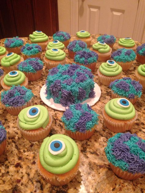 Monster Inc. Mike and Sully cupcakes and smash cake. Monster Inc Smash Cake Ideas, Sully Birthday Cake, Diy Monsters Inc Cake, 1st Birthday Monsters Inc, Sully Cake Monsters Inc, Monsters Inc Halloween Party, Monsters Inc Birthday Party Ideas Food, Monster Inc Party Games, Monsters Inc Themed Birthday Party