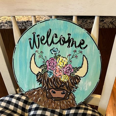 Highland cow with flower headress on a 12 inch round door hanger Highland Cow Door Hanger Wooden, Cow Door Hanger Wooden, Highland Cow Door Hanger, Cow Door Hanger, Circle Door, Hanger Ideas, Round Door Hanger, Circle Canvas, Wooden Door Signs