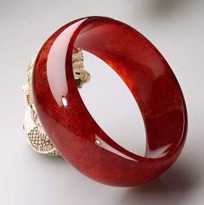 Red Jade bangle  Item Number: 	  SRJB7-1     Stone (s): 	  Red Jade     Color: 	  Red.     Transparency: 	  Semi -Transparent.     Tone: 	  Medium-Dark     Shape & Cut: 	  Solid Jade Band     Jade Finish 	  High Polish     Remarks: 	  Jadeite Jade     Jade Quality: 	  Excellent     Outer Diameter: 	  71.6mm     Inner Diameter : 	  60.5mm     Width: 	  24.3mm     Jade came from: 	  Burma     Retail Price 	  $2500.00     Your Price: 	  $1250.00 Jadeite Jewelry, Bakelite Bracelets, Lavender Jade, Color Jade, Jade Color, Red Jade, Chinese Jewelry, Jade Bangle, Locket Charms