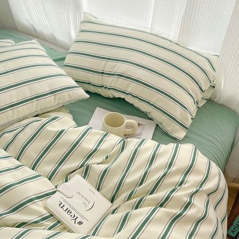 Add a touch of sage green minimalist vintage style to your bedroom with this Minimalist Green Striped Light Sage Bedding Set. This duvet cover set features a striped duvet cover design in green shades. Perfect for those seeking a minimalist inspired aesthetic bedroom and unique room decor. Material: 100% Polyester Inner/Comforter/Pillows not included. See package configuration and sizes below: Single: 1x Duvet Cover: 59x79in (150x200cm)1x Flat Sheet: 63x90in (180x230cm) 1x Pillow Case: 19x29in ( Minimalist Bedding Sets, Sage Bedding, Fall Bedding Sets, Striped Duvet Cover, Polka Dot Bedding, Striped Bedding, Striped Duvet, Striped Quilt, Small Bed