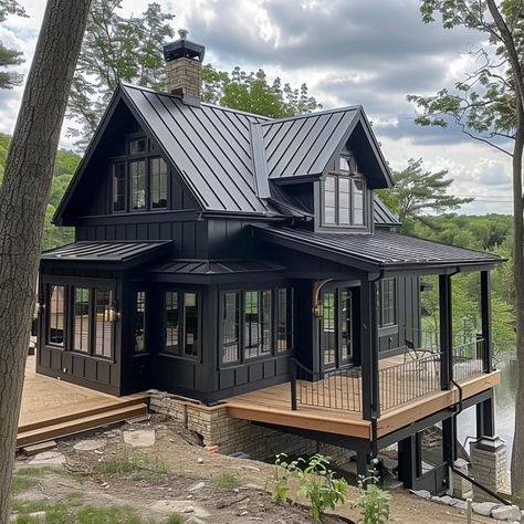 Image Dark Mountain Home Exterior, Dark Lake House, Black Cabin Exterior, Black House With Wood Accents, Black Log Cabin Exterior, Black Lake House, Modern Log Cabins Exterior, Black Wooden House, Modern Black House Exterior