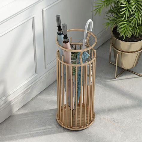 A strong metal frame and fashionable marble pillar design make our umbrella holder both practical and stylish. This minimalist umbrella stand is ideal to hold large quantities of umbrellas for the rain or sun, in your office, home, business, or hotel. At the same time, it is equipped with 3 small hooks for storing fold-up umbrellas. A drip tray drawer catches excess water so it doesn't end up on your floor or entryway and allows for easy cleanup. - Material: Metal- Color: Gold- Overall Dimension Marble Pillar Design, Marble Pillar, Golden Marble, Shell Structure, Pillar Design, Hotel Door, Umbrella Holder, Nordic Lights, Drip Tray