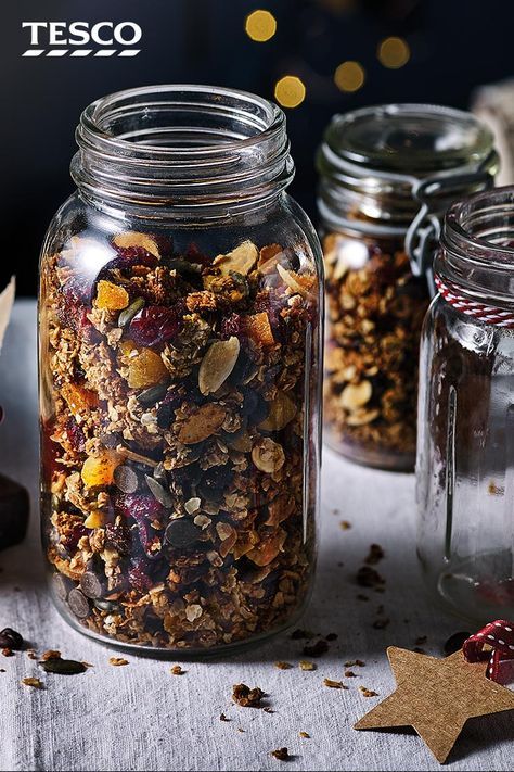 Swap ordinary cereal for this festive granola in December. Filled with cranberries, apricots and even chocolate chips, this easy breakfast will make you start the day in the festive spirit - plus it makes a great edible gift. | Tesco Christmas Baking Ideas Gift, Christmas Granola Recipe, Christmas Day Breakfast, Christmas Granola, Tesco Christmas, Food Gift Ideas, Christmas Food Ideas, Homemade Granola Recipe, A Simple Christmas