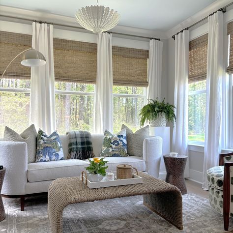 An enclosed sunroom will give you all the delights of a screened in porch but without the insects that can ruin your glass of wine! We love doing sunrooms! 
Reach out today for a quick call to see what we can do for you! #sunroomdesign#cozylivingroomideas#lightingideas #wovenshades #arearug #indoorplants #blueandwhite #plaidpillowcover #whitecurtains#boucle#sunroom#sunroomideas #accentchair #kitchenreno #sunroomidea#porchdecor #mydomaine #sodomino #coastal #whitesofa#coastalvibes #coastaldesign Curtains In Sunroom Window, White Sunroom Ideas, Lakehouse Sunroom, Sunroom Curtain Ideas, Coastal Sunroom, Cozy Sunroom Ideas, Enclosed Sunroom, White Sunroom, Cozy Sunroom