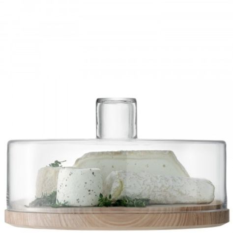 With its broad, soft-grained ash base and handmade glass lid, this cheese/pastry dome is ideal for mouth-watering mounds of sweet treats or a carefully chosen selection of the finest cheeses. Luxuriously gift-boxed. DIMENSIONS Diameter: 32cm, Height: 20cm CARE Handwash the glass in warm soapy water and dry with a soft cloth. Clean the wood with a soft brush or damp cloth. Do not leave immersed in water or place in a dishwasher. Allow to dry naturally. Glass Cheese Dome, Bar Ice Bucket, Cheese Pastries, Cheese Pastry, Cake Dome, Cheese Dome, Luxury Dinnerware, Cheese Serving, Cool Kitchen Gadgets