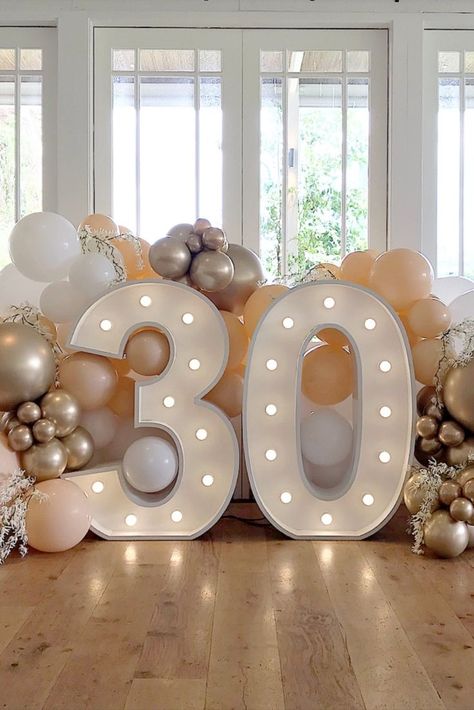 Celebrate your 30th birthday with this stunning Blush and Gold photo backdrop. Event styling and decor at its best and the ultimate event and birthday party inspo. Light up 30 numbers by Big Light Letters and balloon garland by Print Candy www.printcandy.com // Venue: Howard Smith Wharves, Brisbane, AU // Photo by Print Candy. All rights reserved. May not be reproduced. Blush And Gold Birthday Party Decor, Light Numbers Birthday, Blush Birthday Decor, 30th Birthday Party Backdrop, 30th Birthday Ideas Decorations, 30 Balloon Garland, Blush And Gold Party Decor, 30th Balloon Garland, 30th Birthday Party Table Decor