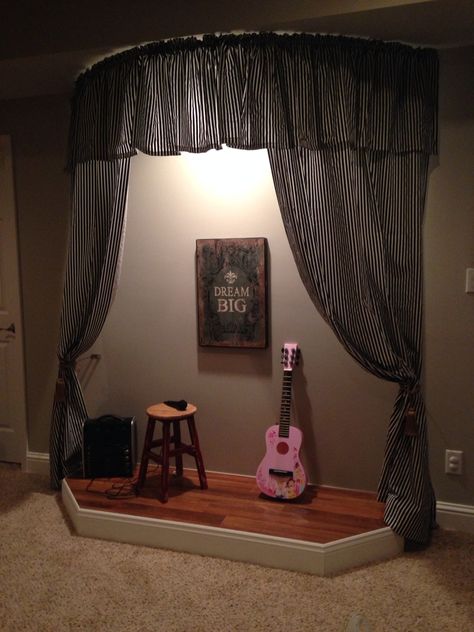 Playroom stage with curtains.                                                                                                                                                                                 More Basement Karaoke Stage, Stage For Playroom, Stage Setup Ideas, Basement Stage Ideas, Playroom Music Area, Karaoke Stage Ideas, Playroom Town Ideas, Playroom Stage Ideas, Stage In Playroom