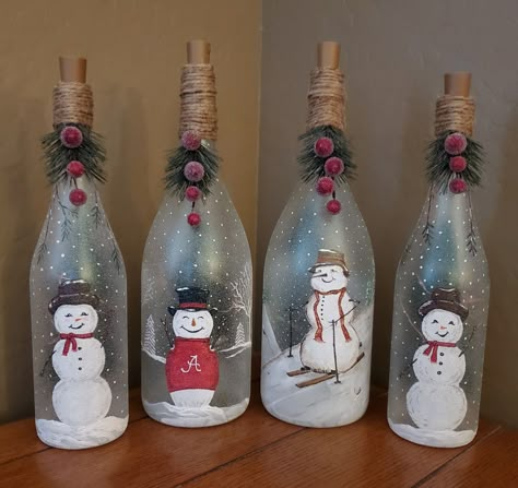 Christmas Painted Glass Bottles, Christmas Wine Bottle Decor, Christmas Theme Bottle Art, Snowman Wine Bottle Crafts, Christmas Light Up Bottles, Winter Wine Bottles, Glass Bottles Art Christmas, Decorated Wine Bottles Christmas, Lighted Wine Bottles Christmas