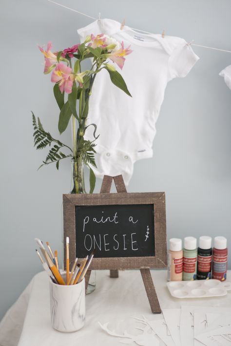 Baby Shower Decorate Onesies, Baby Shower Paint Onsie, Make Your Own Onesie Station, Onsie Making Station Onesie Decorating, Baby Shower Painting Activity, Baby Shower Onesie Painting, Baby Shower Paint Onsies, Paint Baby Shower Theme, Onesie Decorating Station Sign