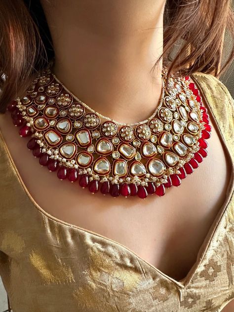 Adorn yourself with the splendor of our Bridal Heavy Kundan Jewellery in a rich maroon and golden hue.  This exquisite Wedding jewellery, inspired by Indian and Pakistani traditions, features intricate designs including Jhumka earrings, Maangtika (forehead ornament), and Punjabi-inspired elements.  Embrace the regal beauty and celebrate your style with this opulent jewellery set that captures the essence of an Indian wedding, adding a touch of glamour and cultural heritage to your special day. Item includes: Necklace, matching earrings and maangtika  Necklace length 16-18 inches with an adjustable zari dori at the back Earrings length 3.5 inches Each earring weighs 30 gms Item is ready to be shipped from New Delhi, India. Please leave your phone number in notes or message when placing orde Maroon Jewellery Set, Kundan Jewellery Set Royals, Royal Bridal Jewellery, Red Indian Wedding, Wedding Jewellery Indian, Heavy Jewellery, Antique Necklace Gold, Lehenga Jewellery, Kundan Jewellery Set