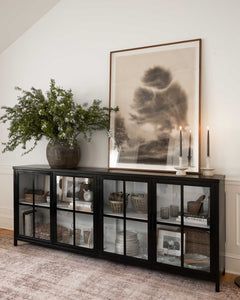 Dining Area Credenza, Living Room With White Couch Decor, Black Cabinets With Glass Doors, Sitting Room With Bar Cart, Black Credenza Living Room, Organic Modern Buffet Table, Kitchen Credenza Decor, Sideboard Glass Doors, Kitchen Island Without Cabinets