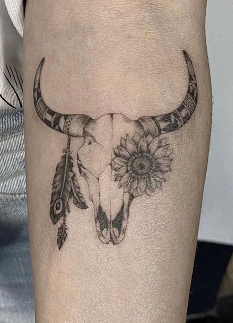 Cow Skull Tattoos: Meanings & Tattoo Ideas Bull Skull Tattoo Women Simple, Cow Head Tattoo Woman, Cow Skull With Sunflowers Tattoo, Small Bull Skull Tattoo For Women, Out West Tattoo Ideas, Country Skull Tattoo, Cow Skull Tattoo Flowers Small, Bull Skull With Sunflowers Tattoo, Bull Skull Tattoo Thigh