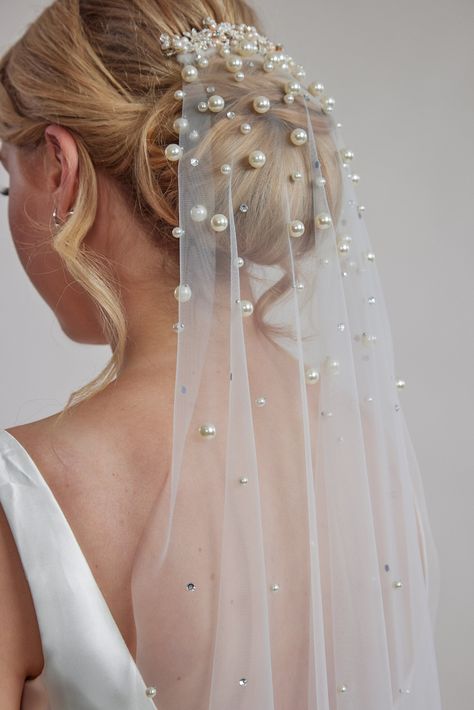 Are you looking for a veil that's both classic and stylish? Look no further! Our single-layer off-white Scattered Pearl Bridal Veil is the perfect addition to your wedding day look. Made from high-quality bridal tulle, this veil is lightweight, sparkling, and utterly romantic. Featuring a beautiful ivory blusher color and a secure comb attachment to keep it in place, this veil ensures both comfort and elegance. Designed by the talented Leah S Designs, it's a stunning choice for any bride seeking Pearled Wedding Veil, Pearl Blusher Veil, Headband Veil Wedding, Bow Veil Wedding, Veils Bridal Hair Down, Fishnet Veil, Wedding Veil Blusher, Pearl Glasses, Pearl Wedding Veil