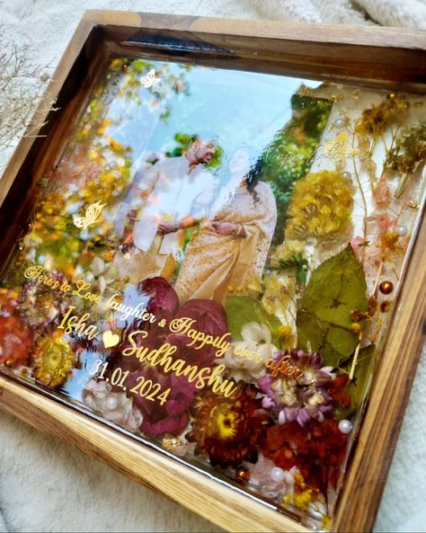 Looking for special gifts for newly weds?? You are in the right place ✨ My dad being a fan of trending teakwood frames asked me , could u create a photo frame as a wedding gift for a couple. And here it is! Crafted this beautiful vibrant yet elegant looking frame for a beautiful couple. And he absolutely loved the frame ❤️ Isn't it a special feeling when our family loves our work & supports us becoming a client ? 💞 Dm to order yours! #weddingframes #weddinginspiration #resinteakwoodframe ... Resin Art Frames For Couple, Gifts For Newly Weds, Photo Frame Wedding, Resin Photo Frame, Best Gifts For Couples, Marriage Anniversary Gifts, Calendar Background, Wallpaper Sky, Iphone Wallpaper Sky