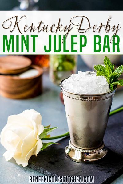 Mint juleps are delicious and fun to drink at parties – especially Kentucky Derby parties! This year create a mint julep cocktail bar featuring easy mint juleps with mint simple syrup. Stock your bar with all the essentials for easy to make mint juleps and let your guests serve themselves. Dust off your Derby hat, whip up a Derby Pie, and pour yourself a Mint Julep. It’s Derby Time! | Renee Nicole's Kitchen @reneenicoleskitchen #mintjulep #cocktailrecipes #authenticmintjulep #reneenicoleskitchen Kentucky Derby Mint Julep, Diy Cocktail Bar, Mint Julep Bar, Mint Julep Cocktail, Bar At Home, Derby Pie, Mint Juleps, Derby Time, Mint Julep Cups