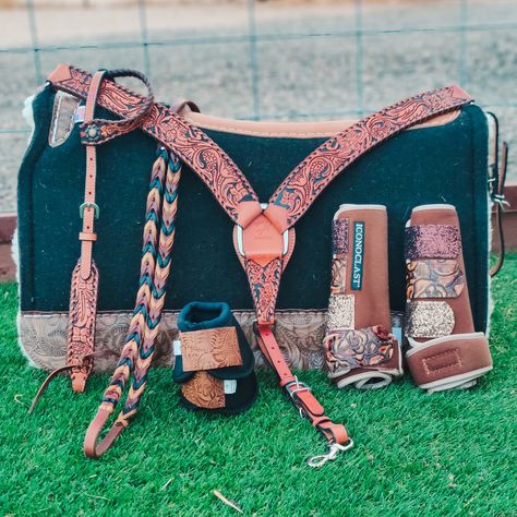 Keep it simple but interesting with this gorgeous tooled tack collection by Rafter T. The lovely floral detailing is set off by the black background lending a subtle but stunning look.  Note - The boots and reins are shown for demonstration only and are not included in a tack set purchase. They may be purchased separat Orange Horse Tack Western, Tack Colors For Horses, Western Horse Tack Sets Barrel Racing, Pretty Horse Tack, Cute Horse Tack, Aqha Western Pleasure, Western Horse Tack Turquoise, Tack For Horses, Western Riding Tack