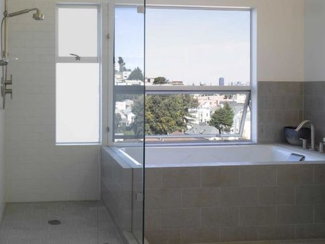 Tiled tub in a modern bathroom Built In Bathtub Tub Surround, Concrete Bathrooms, Tile Around Tub, Tub Skirt, Unfinished Basements, Small Space Bathroom Design, Tile Tub Surround, Built In Bathtub, Modern Tub