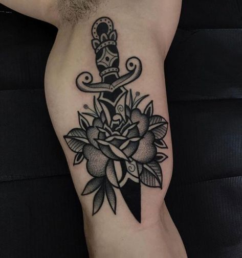 Black and grey rose and dagger bicep tattoo Dagger Reference, Rose And Dagger Tattoo, Traditional Dagger Tattoo, Traditional Heart Tattoos, Traditional Tattoo Stencils, Rose And Dagger, Optical Illusion Tattoos, Illusion Tattoos, Black And Grey Rose