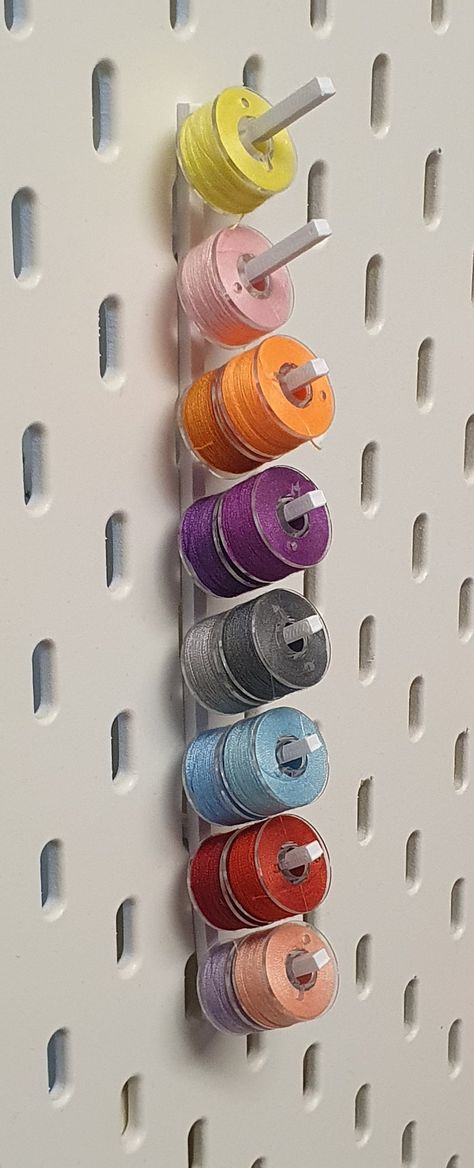 Ikea Skadis Pegboard Thread Spool Holders. Holds 16 spools.  Perfect for sewing enthusiasts and craft rooms. Tired of tangled threads? Our thread holders for Ikea Skadis Pegboard provide a convenient solution. Secure your threads and keep them within arm's reach for uninterrupted crafting  sessions. Whether you're an avid sewer, crafter, or DIY enthusiast, our thread spool holders are a must-have. Keep your sewing accessories neatly arranged, so you can focus on bringing your creative visions to Sewing Spool Storage, Sewing Room Ikea, Laundry Sewing Room, Diy Thread Holder, Mcm Cottagecore, Attic Craft Rooms, Sewing Room Organization Diy, Wrapping Table, Ikea Sewing Rooms