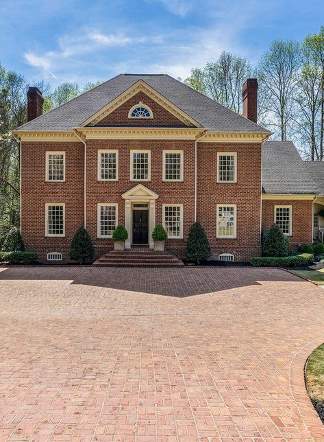 Red brick house with stone trim and a black front door. Red brick driveway. Red Brick Two Story House Exterior, Old Red Brick House, Red Stone House, Red Brick Driveway, Red Brick Colonial House Exterior, Red Brick Homes Exterior, Brick Colonial House Exterior, Brick House Siding, House Without Shutters