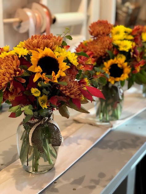 Sunflower Arrangements Fall, Fall Flower Arrangements Mason Jars, Fall Centerpiece With Sunflowers, Fall Vase Arrangements Floral, Yellow Fall Floral Arrangements, Sunflower Fall Centerpieces, Fall Flower Arrangements With Sunflowers, Sunflower And Mum Bouquet, Mum Table Centerpieces