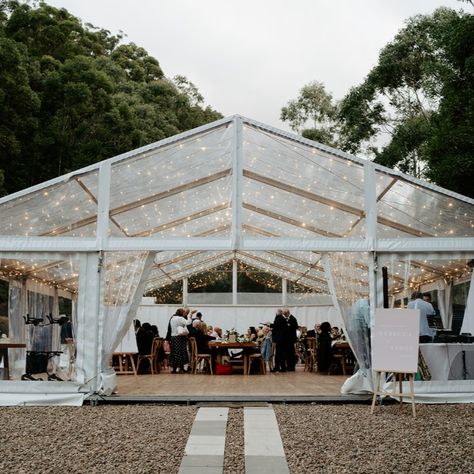 We didn’t want to spoil the incredible and unspoilt night sky at The Bower Estate, so we host our guests in a clear marquee to make the most of our lush surrounds, no matter the time of day. Adorned with a roof of fairy lights, the marquee is a magical space to enjoy. Glass Marquee Wedding, Marquee Fairy Lights, Clear Marquee Wedding, Festoon Lights Wedding, Clear Roof Panels, Backyard Reception, Outdoor Event, Destination Wedding Venues, Festoon Lighting