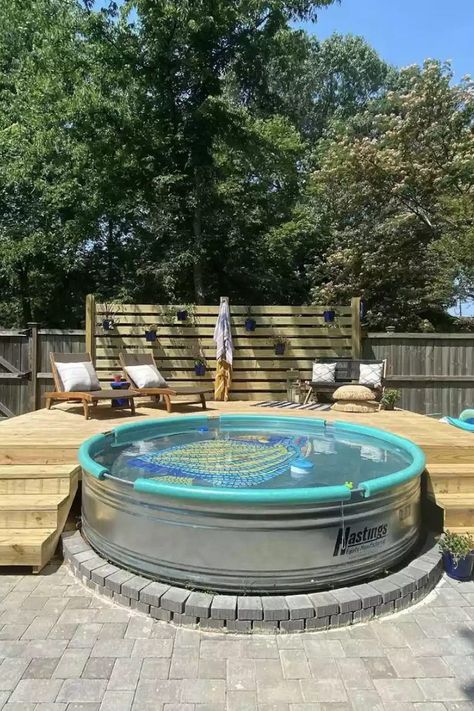 They're known as cowboy pools and trough pools and are seen everywhere! Stock tank pools are replacing more traditional in-ground swimming pools. Enjoy a look at 32 of our favorite stock tank pool designs—along with stock tank tips and how-tos—and get inspired. #StockTankPool #StockTankPoolBackyard #StockTankPoolIdeas #TheSpruce Pool Metal Tub, Small Metal Pools Backyard, Metal Tank Pool, Double Stock Tank Pool, Tractor Supply Stock Tank Pool, Cowboy Pool Deck Ideas, Water Trough Pool With Deck, Cowboy Swimming Pool, Cowboy Swimming Pools