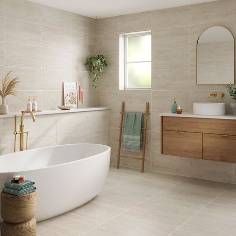 Inspired by the beauty and irregularity of stone, Travertine is a classic range of porcelain wall and floor tiles available in both Grey and Beige with a matt finish. Natural And White Bathroom, Bathroom Same Floor And Wall Tiles, Beige Stone Bathroom Ideas, Sand Floor Tiles Bathroom, Travertine Porcelain Tile Bathroom, Beige And Marble Bathroom, Neutral Bathroom Tiles Ideas, Stone Beige Bathroom, Bathroom Natural Materials