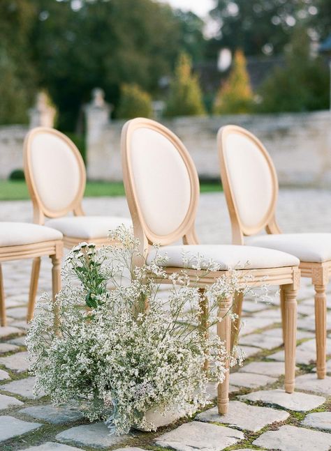 Read More: https://www.stylemepretty.com/2022/02/04/a-chic-french-inspiration-shoot-at-chateau-de-villette/ Wedding Ceremony Furniture, Reception Chairs Wedding, Louis Chairs Wedding, Outdoor Aisle Runner, French Wedding Aesthetic, French Chic Wedding, Outdoor Aisle, Chair Decoration Ideas, Aisle Florals