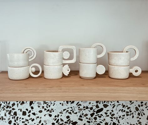 Sturdy ceramic espresso cups, sake cups, and/or shot glasses. Hand-thrown with white clay and glazed with oatmeal (off-white) glaze that allows the natural speckles in the clay to show through. Mugs are stackable, but due to the unique handles, they must be stacked in a particular way. This order is for the complete set of 8 mugs - each unique and special. Microwave and dishwasher safe.  Note: sizes vary. Each cup holds 3-4 oz. Please note that all of the pottery in my shop is hand-made and glaz Coffee Ceramic Set, Stackable Ceramics, Coffee Cup Ceramic, Pottery Espresso Cups, Hand Built Mug, Mug Handles Pottery, Cute Shot Glasses, Pottery Sets, Ceramic Shot Glasses