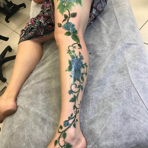 Elaborate Blue Rose Vine Tattoo For Your Entire Leg Rose Vine Tattoo, Vine Tattoo Ideas, Rose Tattoo Leg, Colorful Rose Tattoos, Rosé Legs, Most Painful Tattoo, Rose Vine Tattoos, Vine Tattoo, Blue Rose Tattoos