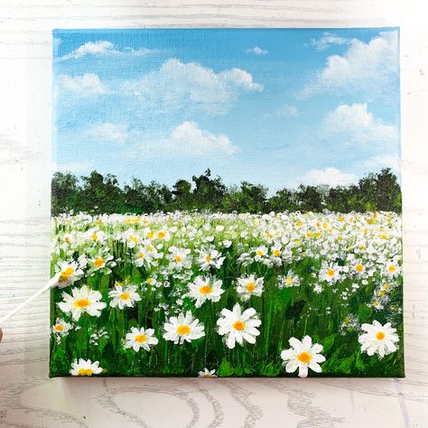 A painting of white daisy field with blue sky and fluffy clouds on green landscape Easy Acrylic Daisy Painting, Natural Painting Easy, Easy Meadow Painting, Easy Flower Landscape Painting, Diy Daisy Painting, Daisy Field Drawing, Acrylic Painting Canvas Acrylic Painting Canvas Landscapes, Flower Scenery Painting Easy, Field Of Daisies Drawing