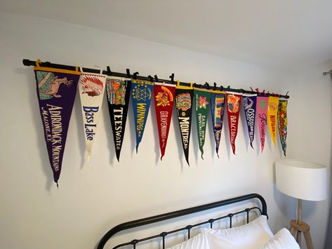 Pennant Wall Display, Decorating With Pennants, How To Hang Pennants On Wall, Sports Pennant Display, Pennant Decor Ideas, Pennant Flag Display, Vintage Camp Interior, Sports Pennant Display Ideas, Pennant Flags Decor