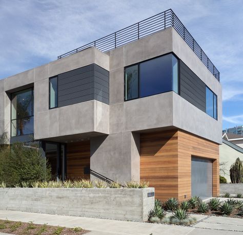 Modern home with Exterior, House, Flat RoofLine, Wood Siding Material, Metal Siding Material, and Stucco Siding Material. Front Corner View Photo 2 of Oxford Residence House Concrete Exterior, Stucco Homes Modern, Concrete And Wood House Exterior, Stucco Cement Finish, Modern Exterior Materials, Concrete Siding Exterior House, Light Grey Stucco House Exterior, Stucco And Wood Exterior, House Exterior Materials