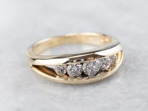 This diamond wedding band has a refined elegance! The channel setting provides a sleek frame for the stones, while also protecting them from everyday wear. The diamonds are bright and sparkling, a fabulous focal point! Metal: 14K Yellow Gold Gem: 5 Diamonds totaling .64 Carats, I in Color, SI in Clarity Width of Band: 6.7 mm Height off Finger: 4.5 mm Ring Size: 7.75 Marks: "14K P" Stamped on the inside band Thick Gold Ring With Diamonds, Men's Diamond Rings, Wide Band Wedding Ring, Channel Set Diamond Engagement Ring, Wide Band Diamond Rings, Diamond Stacking Band, Wedding Stack, Thick Wedding Bands, Gold Band Engagement Rings