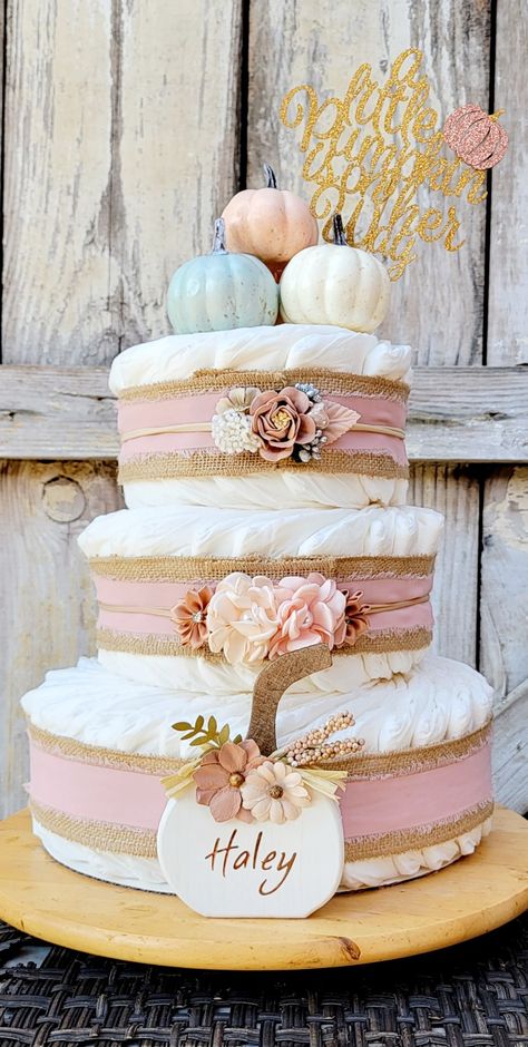 Fall Candy Bar Ideas, Diaper Cake Pumpkin Theme, Pink Pumpkin Shower Ideas, Baby Girl Baby Shower Themes Fall, Fall Baby Shower Diaper Cakes, Pink Pumpkin Baby Shower Centerpieces, Fall Pink Baby Shower Ideas, Diaper Cake Fall Theme, Pink Pumpkin Baby Shower Theme