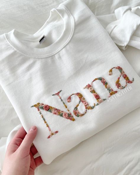 🌸 The sweetest gift, for the sweetest person in your life ✨🥹 Absolutely in love with how this order turned out! The colors are just perfect and the with sweatshirt really displays them beautifully. Mother’s day is around the corner! Would you treat your Nana with one of these? 🩷 #handembroidery #giftforgrandma #momlife #grandma #embroideredclothing #flowerembroidery #mothersdaygiftideas Nana Embroidery, Hand Embroidered Letters, Sweatshirts Embroidery, Initial Sweatshirt, Gift Embroidery, Embroidery Letter, Embroidered Letters, Embroidered Initials, Floral Initial