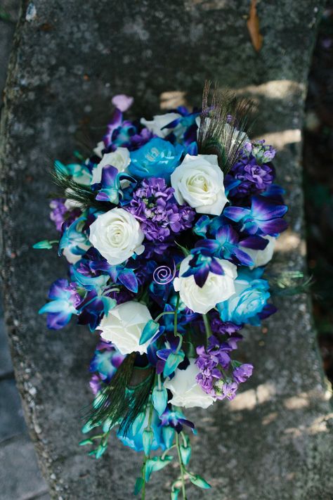 Peacock bouquet photography Regalo Wedding bouquet roses blue bomb orchids purple blue and ivory Peacock Wedding Flowers, Blue Purple Wedding, Galaxy Wedding, Green Wedding Flowers, Bouquet Photography, Purple Wedding Bouquets, Purple Wedding Theme, Blue Wedding Bouquet, Blue And Purple Flowers