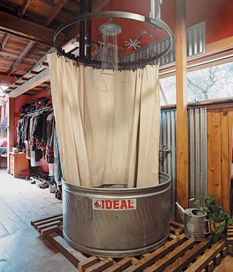 The showers are made from stock-watering tanks from the Ideal Stock Tank Co. and have waterproof canvas curtains. Less expensive than pre... Stock Tank Bathtub, Bin House, Canvas Curtains, Galvanized Tub, Water Trough, Hunting Cabin, Stock Tank, Diy Shower, Dream Barn