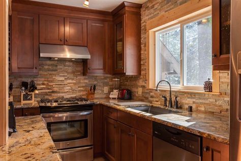 Small craftsman galley kitchen with stacked stone backsplash, brown cabinets and beige granite countertops Gallery Kitchen Layout, Small Galley Kitchen Designs, Small Galley Kitchen Remodel, Stacked Stone Backsplash, Small Galley Kitchen, Stone Backsplash Kitchen, Galley Kitchen Design, Kitchen Remodel Countertops, Galley Kitchen Remodel