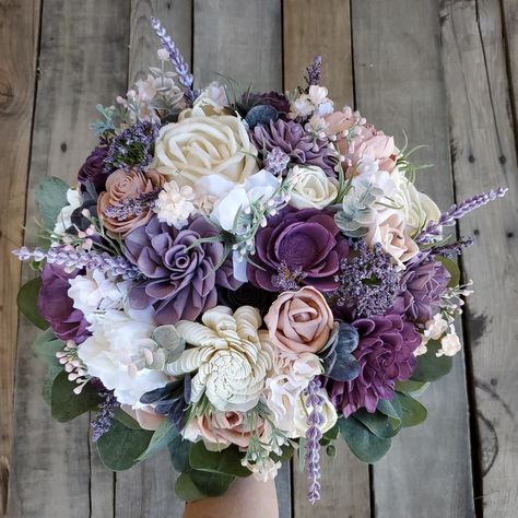 💥ALL SALES ARE FINAL💥 Wood Flower Bouquet, Purple Bridal Bouquet, Lavender Wedding Bouquets, Purple Wooden Flower Bouquet, Lavender Wood Wedding Flowers 🖌flower colors include cream, purple, dusty lavender, light pink, and blush 🤚handle is fully wrapped in twine with a cream ribbon overlay and stems are hidden underneath with artificial silver dollar eucalyptus 💐1st image shows our XLarge 12" bouquet 🥀cascading bouquet diameter is taken at the widest point at the top 📚PLEASE READ📚 •IMPOR Lavender Flower Bouquet, Christmas Wedding Bouquets, Wooden Flower Bouquet, Lavender Wedding Bouquet, Flower Bouquet Delivery, Lavender Bridal Bouquet, Purple Bridal Bouquet, Wood Flower Bouquet, Lavender Flower