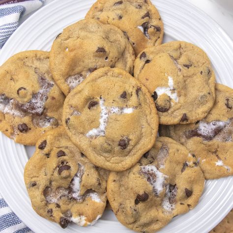 S'mores stuffed cookies are a loaded chocolate chip cookie. Loaded with graham cracker, chocolate and marshmallows in each bite! Give these cookies a try soon! #passion4savings #cookies #smores #stuffed #chocolatechip #marshmallows #grahamcracker S’mores Chocolate Chip Cookies Easy, Graham Cracker Chocolate Chip Cookies, S’more Chocolate Chip Cookies, S’mores Chocolate Chip Cookies, Smores Chocolate Chip Cookies, Marshmallow Chocolate Chip Cookies, Cookies Smores, Cracker Chocolate, Chocolate Chip Marshmallow Cookies